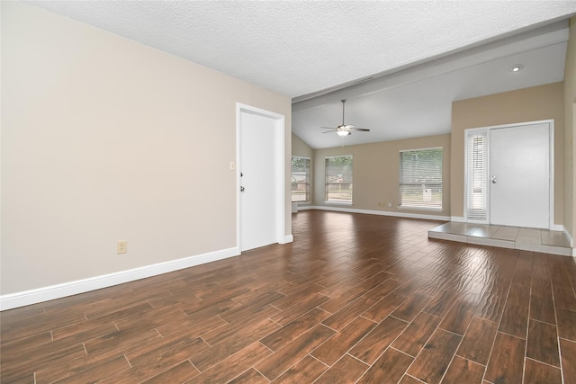 unfurnished living room with baseboards, dark wood finished floors, ceiling fan, and vaulted ceiling