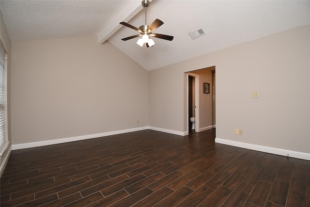 spare room with dark wood finished floors, a ceiling fan, baseboards, vaulted ceiling with beams, and visible vents