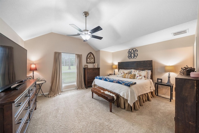 bedroom featuring visible vents, lofted ceiling, baseboards, light colored carpet, and a ceiling fan