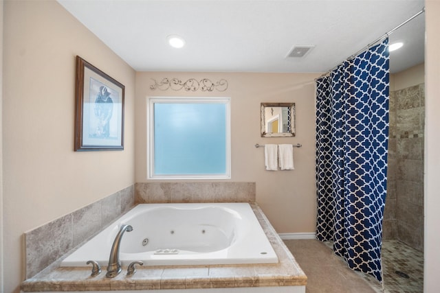 full bathroom featuring a tub with jets, visible vents, and a tile shower
