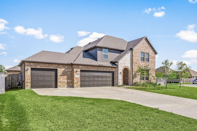 31214 Gullwing Manor Dr, Tomball, TX 77375 - french country home featuring fence, an attached garage, a front lawn, brick siding, and concrete driveway