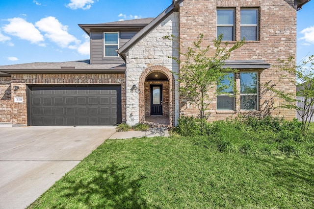 31214 Gullwing Manor Dr, Tomball, TX 77375 - view of front of house with concrete driveway, brick siding, and an attached garage