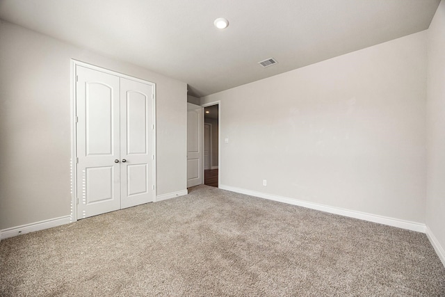 31214 Gullwing Manor Dr, Tomball, TX 77375 - unfurnished bedroom with carpet floors, recessed lighting, baseboards, visible vents, and a closet