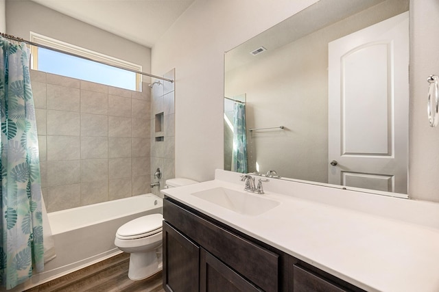 31214 Gullwing Manor Dr, Tomball, TX 77375 - full bath featuring vanity, toilet, shower / bath combination with curtain, wood finished floors, and visible vents