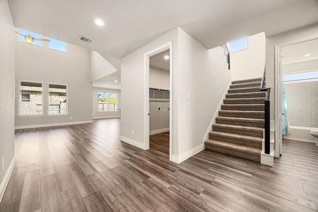 31214 Gullwing Manor Dr, Tomball, TX 77375 - interior space featuring stairway, recessed lighting, wood finished floors, and visible vents