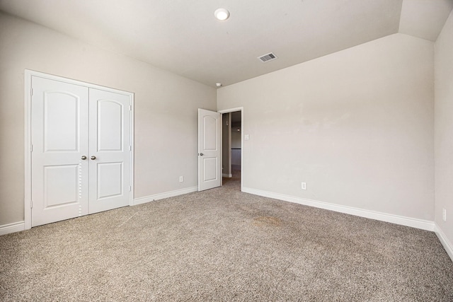 31214 Gullwing Manor Dr, Tomball, TX 77375 - unfurnished bedroom featuring visible vents, baseboards, carpet floors, and lofted ceiling