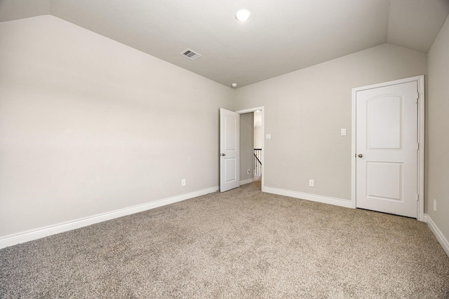 31214 Gullwing Manor Dr, Tomball, TX 77375 - unfurnished bedroom featuring vaulted ceiling, light carpet, and visible vents