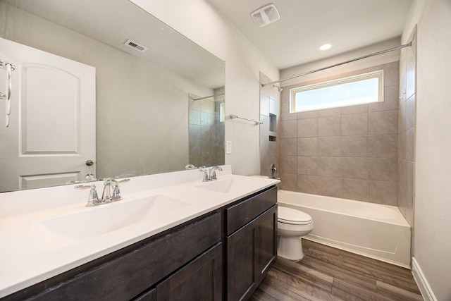 31214 Gullwing Manor Dr, Tomball, TX 77375 - full bathroom with a sink, toilet, wood finished floors, and visible vents