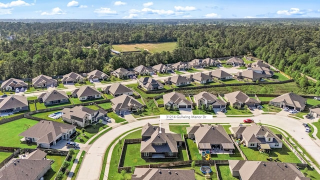 31214 Gullwing Manor Dr, Tomball, TX 77375 - drone / aerial view with a residential view and a view of trees