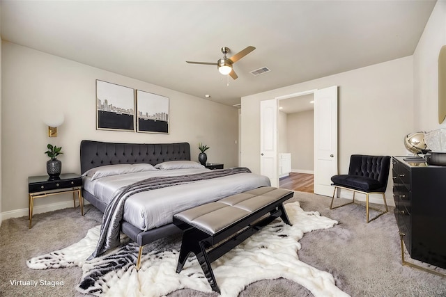 31214 Gullwing Manor Dr, Tomball, TX 77375 - bedroom with carpet floors, baseboards, visible vents, and ceiling fan