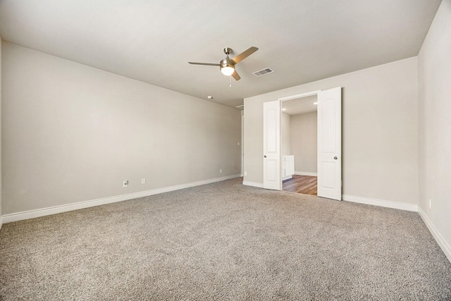 31214 Gullwing Manor Dr, Tomball, TX 77375 - unfurnished bedroom featuring carpet floors, baseboards, a ceiling fan, and visible vents