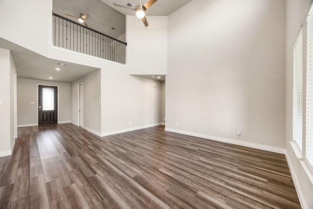 31214 Gullwing Manor Dr, Tomball, TX 77375 - unfurnished living room with a ceiling fan, dark wood finished floors, and a wealth of natural light