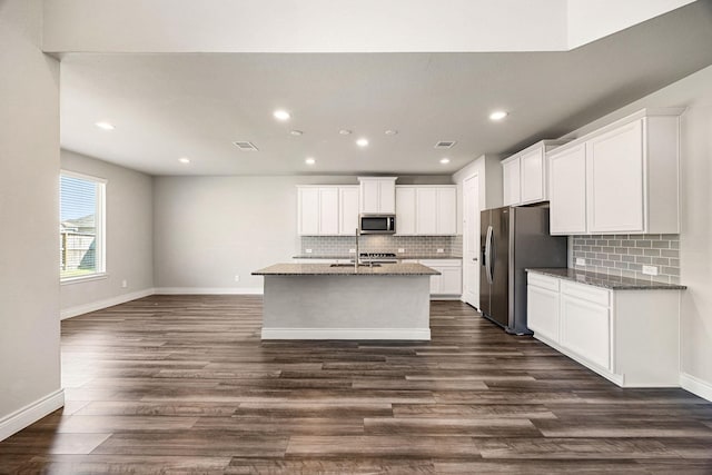 31214 Gullwing Manor Dr, Tomball, TX 77375 - kitchen with recessed lighting, baseboards, appliances with stainless steel finishes, and tasteful backsplash