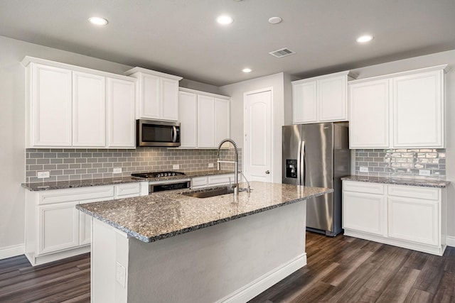 31214 Gullwing Manor Dr, Tomball, TX 77375 - kitchen featuring a sink, stainless steel appliances, dark wood-style floors, and visible vents