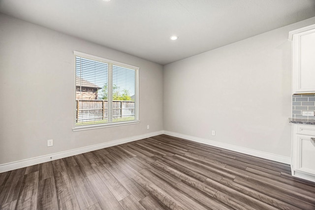 31214 Gullwing Manor Dr, Tomball, TX 77375 - spare room featuring recessed lighting, baseboards, and dark wood-style flooring