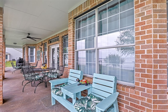 view of patio featuring a ceiling fan and outdoor dining space