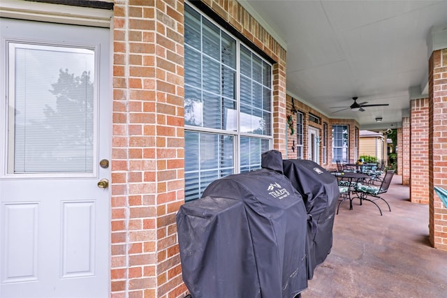 view of patio / terrace with area for grilling, ceiling fan, covered porch, and outdoor dining area