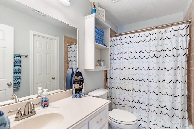 bathroom featuring toilet, visible vents, curtained shower, and vanity