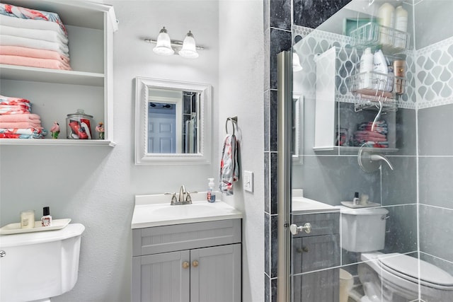 bathroom featuring toilet and vanity