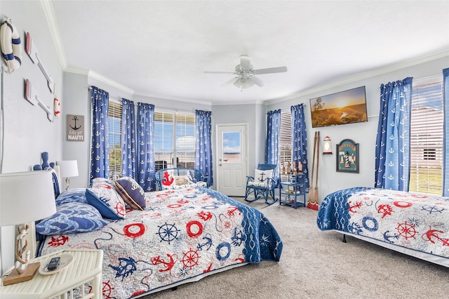 bedroom featuring carpet floors, ornamental molding, ceiling fan, and multiple windows