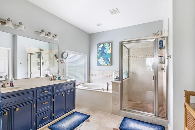 full bathroom with visible vents, a shower stall, a sink, and a garden tub