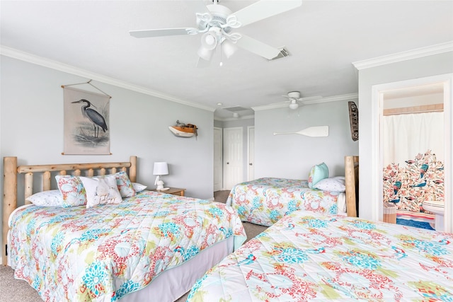 carpeted bedroom featuring visible vents, ornamental molding, and a ceiling fan