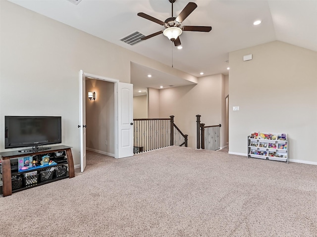 carpeted living area with a ceiling fan, visible vents, baseboards, lofted ceiling, and recessed lighting