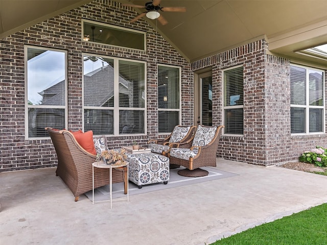 view of patio with ceiling fan and an outdoor living space