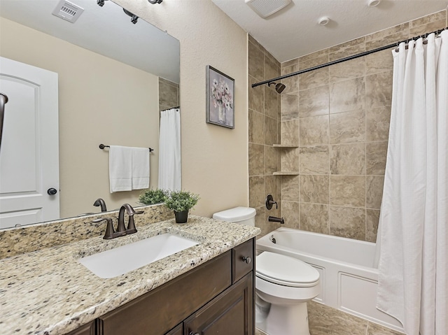 full bathroom with toilet, visible vents, shower / bath combo, and vanity