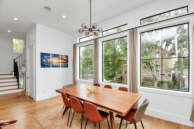 2303 Yupon St, Houston, TX 77006 - dining space featuring visible vents, stairs, plenty of natural light, and baseboards