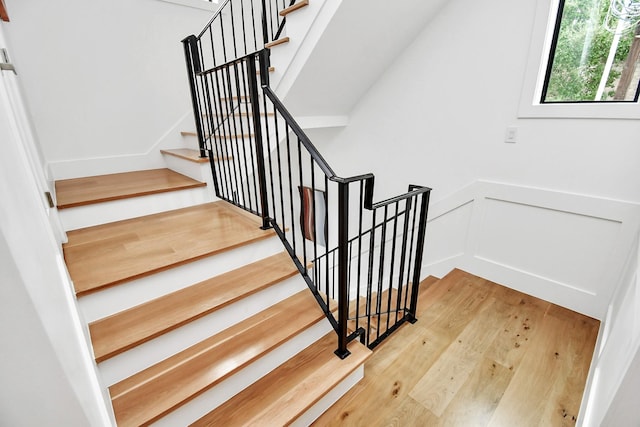 2303 Yupon St, Houston, TX 77006 - stairway with wood finished floors and a decorative wall