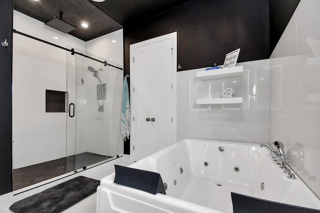 2303 Yupon St, Houston, TX 77006 - bathroom with recessed lighting, visible vents, a tub with jets, and a stall shower