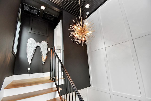2303 Yupon St, Houston, TX 77006 - stairway featuring an inviting chandelier