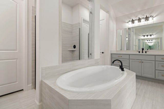 21873 Otter Point Ln, Porter, TX 77365 - full bath with a garden tub, tile patterned floors, a tile shower, and vanity