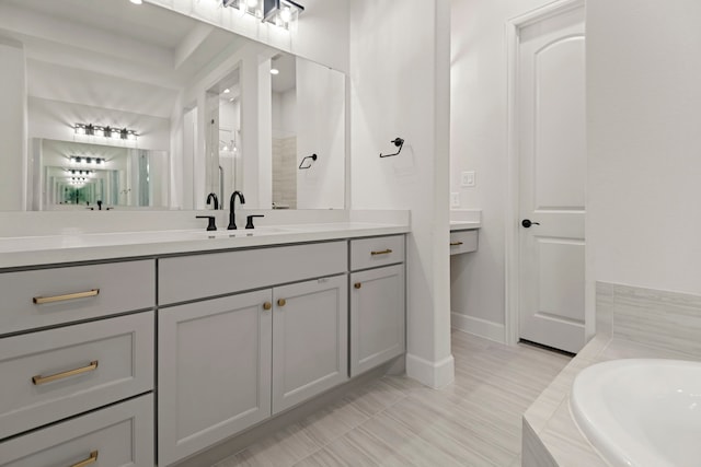 21873 Otter Point Ln, Porter, TX 77365 - bathroom with baseboards, a bathtub, a shower, and vanity