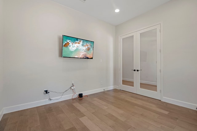 21873 Otter Point Ln, Porter, TX 77365 - clothes washing area with laundry area, light wood finished floors, french doors, recessed lighting, and baseboards