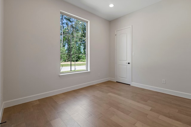 21873 Otter Point Ln, Porter, TX 77365 - empty room featuring baseboards, recessed lighting, and light wood-type flooring
