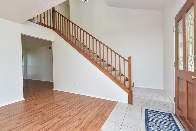 2814 River Birch Dr, Sugar Land, TX 77479 - foyer entrance with baseboards, stairs, and light wood-type flooring