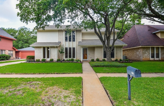 2814 River Birch Dr, Sugar Land, TX 77479 - view of front facade featuring brick siding, a garage, a front lawn, and cooling unit