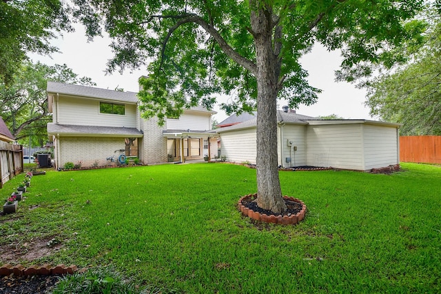 2814 River Birch Dr, Sugar Land, TX 77479 - rear view of house featuring fence, cooling unit, a lawn, and brick siding