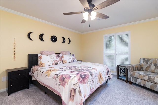 carpeted bedroom featuring crown molding, baseboards, and ceiling fan