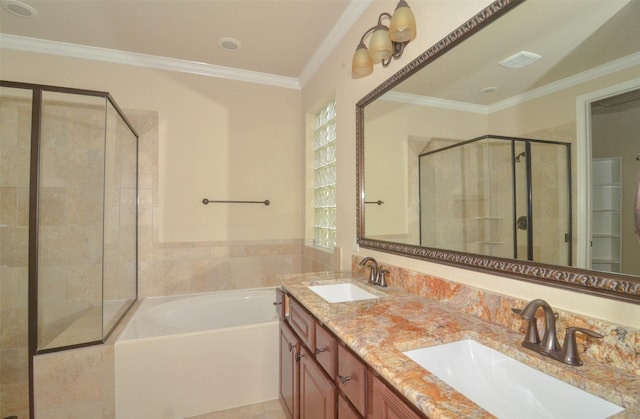 bathroom featuring a sink, crown molding, a stall shower, and a bath