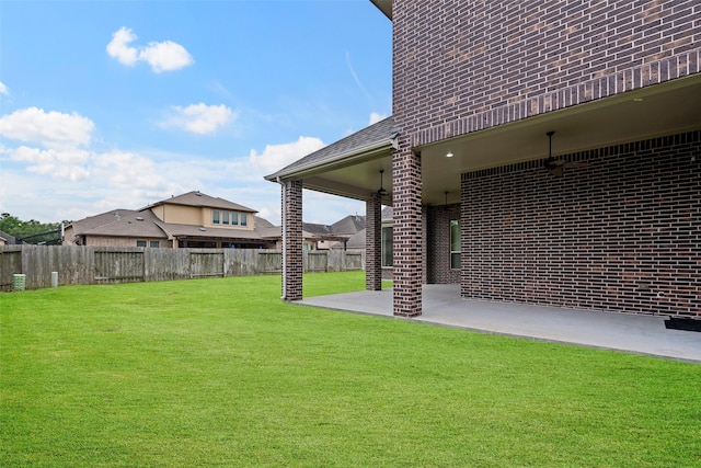 view of yard with a fenced backyard and a patio
