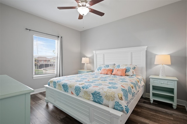 bedroom with dark wood-style flooring, baseboards, and ceiling fan