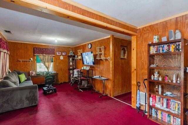1817 Mcdaniel St, Houston, TX 77093 - living room featuring wooden walls, carpet flooring, visible vents, and crown molding