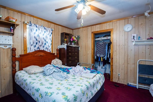 1817 Mcdaniel St, Houston, TX 77093 - carpeted bedroom with wood walls, ornamental molding, and a spacious closet