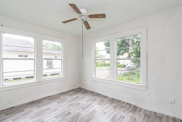 1817 Mcdaniel St, Houston, TX 77093 - empty room featuring a healthy amount of sunlight, baseboards, a ceiling fan, and light wood-type flooring