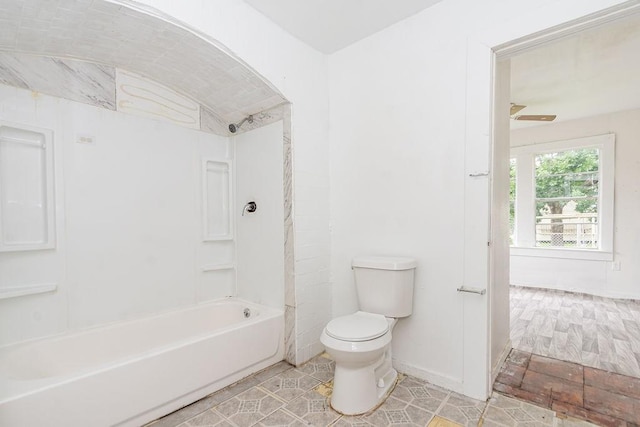1817 Mcdaniel St, Houston, TX 77093 - bathroom featuring baseboards, tub / shower combination, and toilet