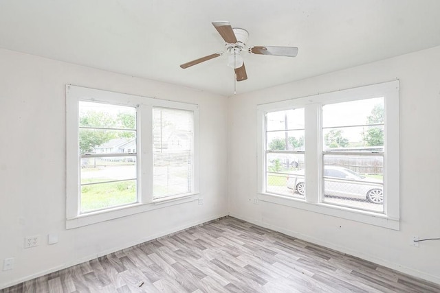 1817 Mcdaniel St, Houston, TX 77093 - unfurnished room featuring a ceiling fan, baseboards, and light wood-style floors