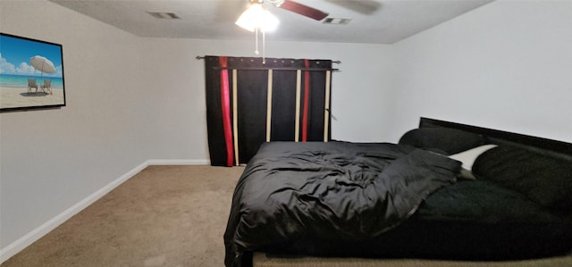 carpeted bedroom featuring a ceiling fan, baseboards, and visible vents
